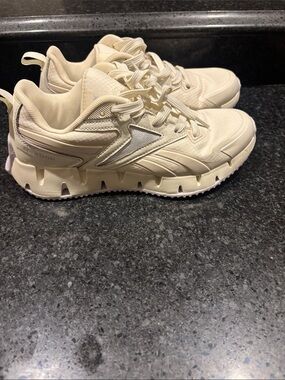 Reebok Neutral Beige and lavender Trail-Inspired Sneakers